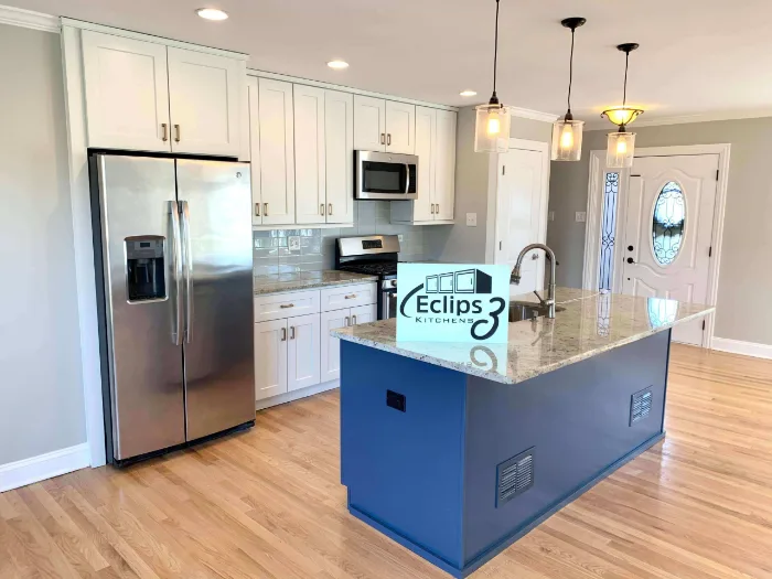 Cabinet color change: white upper cabinets with a navy blue island