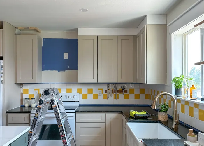 Upper kitchen cabinets with new crown molding added during a cabinet modification