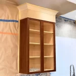 Cabinet modification in progress: upper cabinet being resized in the Eclips3 shop