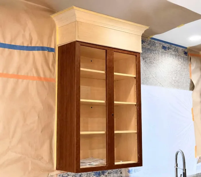 Cabinet modification in progress: upper cabinet being resized in the Eclips3 shop