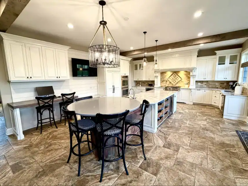 Kitchen with white refinished cabinets after refinishing
