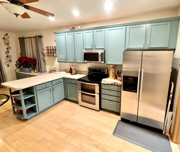 Cabinet painting: sage green kitchen cabinets with stainless steel appliances
