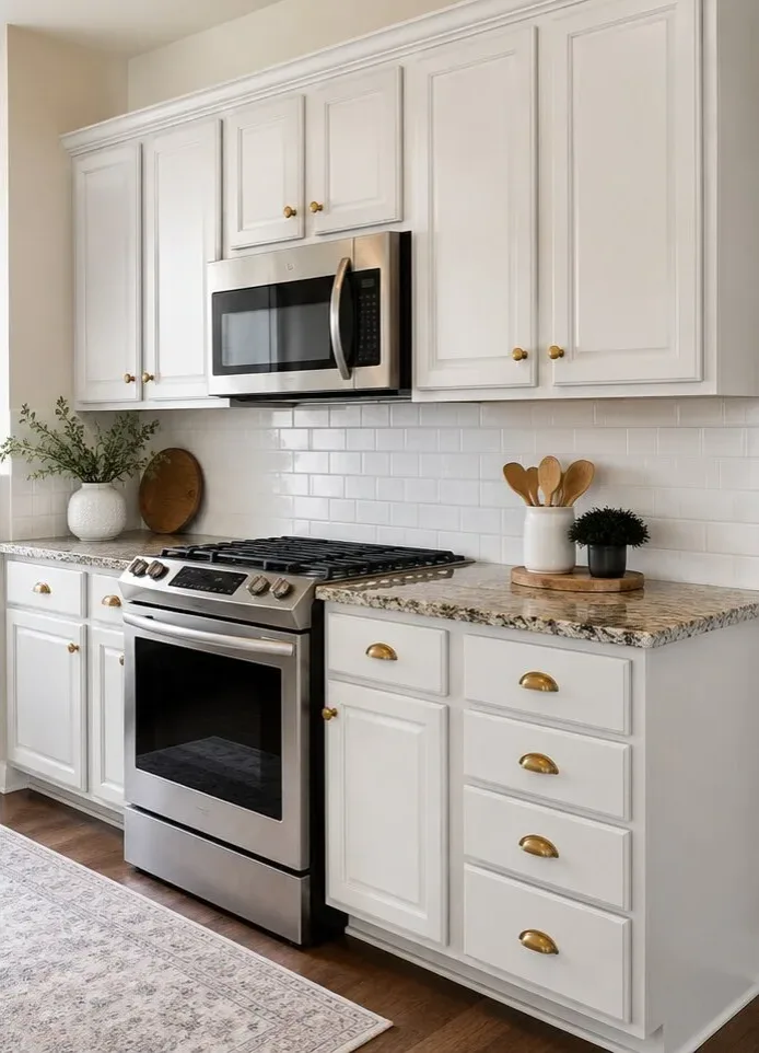 After: the same kitchen cabinets refinished in bright white